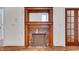 Elegant living room featuring a fireplace and glass-paneled doors at 4853 Stonehall Pl, Atlanta, GA 30339