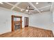 Bright living room with hardwood floors, a ceiling fan, and a decorative fireplace at 4853 Stonehall Pl, Atlanta, GA 30339