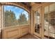 Enclosed porch featuring an arched brick detail and french door at 4853 Stonehall Pl, Atlanta, GA 30339