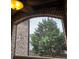 The window features a brick exterior with mature trees in view at 4853 Stonehall Pl, Atlanta, GA 30339