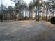 Large, grassy backyard surrounded by mature trees, offering privacy and space at 354 Mansfield Way, Stockbridge, GA 30281