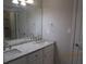 Bathroom featuring a double vanity with stone countertops and modern fixtures at 354 Mansfield Way, Stockbridge, GA 30281