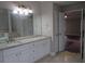 Bright bathroom with a double vanity, granite countertops, and an open doorway into a bedroom at 354 Mansfield Way, Stockbridge, GA 30281