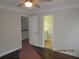 Bedroom with hardwood flooring, crown molding, and an ensuite bathroom at 354 Mansfield Way, Stockbridge, GA 30281