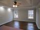 Spacious bedroom features hardwood floors, two large windows, and recessed lighting at 354 Mansfield Way, Stockbridge, GA 30281