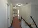 Hallway with crown molding, new paint, and access to multiple rooms in the home at 354 Mansfield Way, Stockbridge, GA 30281