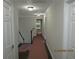 Hallway with fresh paint, crown molding, and hardwood floors leading to other areas of the home at 354 Mansfield Way, Stockbridge, GA 30281