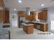 Well-appointed kitchen with stainless steel appliances, granite countertops, and ample cabinet space at 354 Mansfield Way, Stockbridge, GA 30281