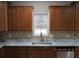 Kitchen features granite countertops and wood cabinets at 354 Mansfield Way, Stockbridge, GA 30281