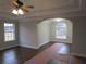 Open-concept living room features hardwood floors, large windows, and architectural details at 354 Mansfield Way, Stockbridge, GA 30281