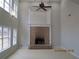 Bright room boasts a brick fireplace, high ceilings, decorative trim, and multiple windows at 354 Mansfield Way, Stockbridge, GA 30281