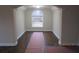 Bright living room with a large window and arched entrance for a view of the neighborhood at 354 Mansfield Way, Stockbridge, GA 30281