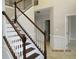 View of staircase with wood trim and white spindles and risers at 354 Mansfield Way, Stockbridge, GA 30281