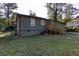 House exterior showcasing a deck and grassy backyard at 5094 Mable Lake Sw Dr, Mableton, GA 30126