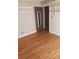 Bright bedroom with hardwood floors and built-in shelves at 5094 Mable Lake Sw Dr, Mableton, GA 30126