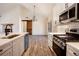 Modern kitchen with an island, stainless steel appliances, and a farmhouse sink at 157 Clay Wade Dr, Canton, GA 30114