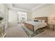 Spacious main bedroom with tray ceilings, neutral decor, and ample natural light at 5225 Maggie Mae Ln, Cumming, GA 30028