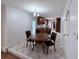 Cozy dining area with a round table, chairs, and tile flooring at 300 Redford Trl, Stockbridge, GA 30281