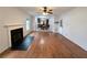 Bright living room with a fireplace, ceiling fan, and hardwood floors at 300 Redford Trl, Stockbridge, GA 30281