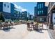 Exterior view of a community with patio area, chairs, tables, and apartment buildings at 371 Grant Se Cir # 1814, Atlanta, GA 30315