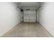 Empty single car garage featuring concrete floor and white walls at 371 Grant Se Cir # 1814, Atlanta, GA 30315