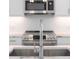 Contemporary kitchen with marble counters, stainless appliances, and modern fixtures at 371 Grant Se Cir # 1814, Atlanta, GA 30315