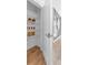 Pantry shelving stocked with food items, with a modern accent wall nearby at 371 Grant Se Cir # 1814, Atlanta, GA 30315