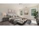 Bright main bedroom with large windows, plush bed, and stylish decor at 1246 Bell Ave, East Point, GA 30344