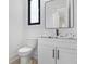 Modern powder room with white vanity, marble countertop, and black accents at 1660 Union Grove Church Rd, Auburn, GA 30011