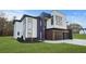 Modern two-story home featuring white and black brick and siding with a well-manicured lawn at 1660 Union Grove Church Rd, Auburn, GA 30011