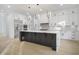 Modern kitchen with a large island and stainless steel appliances at 1660 Union Grove Church Rd, Auburn, GA 30011