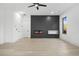 Bright living room with a modern electric fireplace and hardwood floors at 1660 Union Grove Church Rd, Auburn, GA 30011