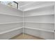 Walk-in pantry with ample shelving for storage at 1660 Union Grove Church Rd, Auburn, GA 30011