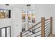 Two-story foyer with a modern chandelier and large windows at 1660 Union Grove Church Rd, Auburn, GA 30011