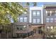 Modern townhouse featuring brick facade, multiple stories, covered entry, and wrought iron railing at 391 Pratt Se Dr # 704, Atlanta, GA 30315