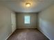 Simple bedroom with carpeted floor and a window at 194 Spring Leaf Dr, Dallas, GA 30157