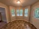 Bright breakfast nook with bay window and tile flooring at 194 Spring Leaf Dr, Dallas, GA 30157