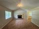 Living Room with vaulted ceiling, fireplace and view into kitchen at 194 Spring Leaf Dr, Dallas, GA 30157