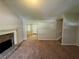 Open living room with a view of the kitchen and staircase at 194 Spring Leaf Dr, Dallas, GA 30157