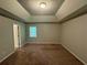 Large main bedroom with high ceilings and carpet at 194 Spring Leaf Dr, Dallas, GA 30157