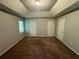 Spacious main bedroom with high ceilings and carpet at 194 Spring Leaf Dr, Dallas, GA 30157