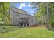 House exterior view with large backyard and mature trees at 7445 Talbot, Sandy Springs, GA 30328