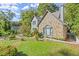 Stone and gray sided home with walkway and landscaping at 7445 Talbot, Sandy Springs, GA 30328