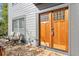 Double wooden doors with glass panels and stone flooring at 7445 Talbot, Sandy Springs, GA 30328