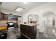 Well-equipped kitchen with stainless steel appliances, granite countertops, a center island and dark wood cabinetry at 7445 Talbot, Sandy Springs, GA 30328