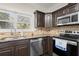 Modern kitchen with stainless steel appliances and granite countertops at 7445 Talbot, Sandy Springs, GA 30328