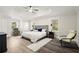 Spacious main bedroom featuring a tray ceiling, neutral tones, and ample natural light from multiple windows at 7445 Talbot, Sandy Springs, GA 30328