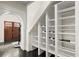 Custom-built under-stair storage with shelving for wine and other items at 7445 Talbot, Sandy Springs, GA 30328