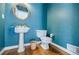 Charming powder room with pedestal sink and toile wallpaper at 5440 Shady Grove Rd, Cumming, GA 30041