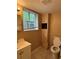 This bathroom has tile flooring, a white vanity, and a toilet by the window at 3715 Leisure Ln, College Park, GA 30349